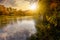 Forest river in autumn mountains at sunset