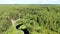 Forest river in the summer taiga from a height of flight