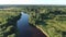 Forest river in the summer taiga from a height of flight