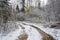 Forest road, covered with the first snow.