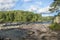 forest rocks rock blue sky clouds sunlight stormy river waterfall