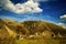 Forest, rocky mountains and blue sky