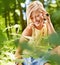 Forest, thinking and woman with sunshine, fashion and ideas with tourism, adventure and countryside. Person, travel and
