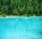 Forest and turquoise lake in the Dolomites apls, Italy. Lago di Sorapis lake in the Italy. Beautiful landscape at the summer time.