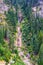 Forest waterfall in summer mountain