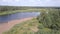 Forest, wild beach, Western Dvina river and fisherman