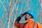 Forestry technician looking up at treetops