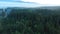 Forests and mountains of the Southern Urals near the village of Tyulyuk in Russia early in the morning. Drone view.