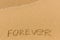 Forever - drawn on the sand beach