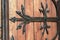 Forged door pattern, decorative. Old vintage entrance, massive heavy wooden door of church or cathedral