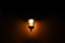 A forged lantern that glows dimly in the dark.