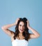 Forget good hair day, Im having an awesome hair day. Studio shot of an attractive young woman feeling joyful against a