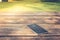 Forget and Lose Concept : Black smartphone place on wooden table at public park.