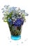 Forget-me-not flowers in a blue transparent glass