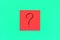 Forget, reminder, combination of colour concept- Close up black handwritten symbol of question mark on one red square sticker on