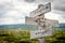 forgive and forget text engraved on old wooden signpost outdoors in nature