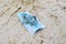 Forgotten  or  discarded surgical mask on ground