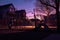 forgotten playground with shadows lengthening at dusk