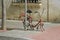 Forgotten red bicycle attached to street pillar with lock stands without wheels on the street of Calella