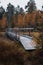 Forgotten wooden bridge in the middle of desolate and raw nature in the Kainuu region of Finland in autumn