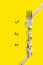 Fork and centimeter on yellow background. Numbers of ideal shape