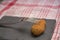 A fork on a croquette on a black table