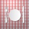 Fork, Plate and Knife on Tablecloth