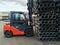 Forklift carrying plastic drain pipes pvc