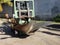 A forklift carrying a ship\'s propeller