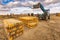 Forklift on a construction site, preparing to raise construction parts