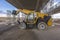 Forklift on a construction site, preparing to raise construction parts