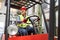 Forklift driver driving a forklift in a haulage company