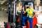 Forklift driver at warehouse of forwarding