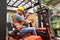 Forklift driver in the warehouse of a haulage company