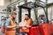 Forklift drivers and warehouse workers talk to each other