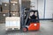 Forklift driving with a palet