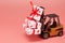 Forklift and gift boxes on pink background with copy space. Valentine`s Day