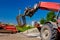 Forklift lifts the rebar bundle from ground on building site