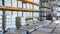 Forklift loader drives pallets with bobbins at warehouse