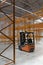 Forklift loader in new empty modern storehouse