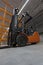 Forklift loader in new empty modern storehouse. Wide angle