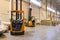 Forklift loader parking at logistics warehouse. Pallet stacker truck equipment inside of a modern warehouse storage