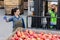 Forklift loading truck with container full of red apples. Fruits and food distribution to market