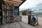 A forklift loads bales of compressed plastic bottles into a truck trailer.