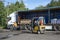 A forklift loads construction goods into a truck