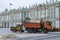 A forklift loads the removed snow into a dump truck. Saint Petersburg