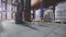 Forklift in motion close-up. Close-up of a forklift moving through a warehouse. Forklift wheels close-up