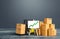 Forklift near boxes and easel with green arrow up. Growth trade and production rates, increased sales. High import export.