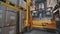 Forklift rearranges boxes at warehouse, large industrial warehouse, movement of machinery at warehouse
