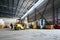 Forklift transporting loads inside the industrial warehouse.